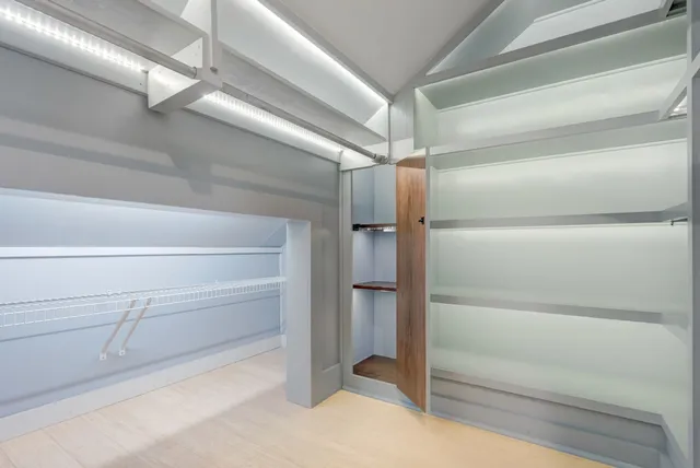 a bathroom with a glass shower door and a sink