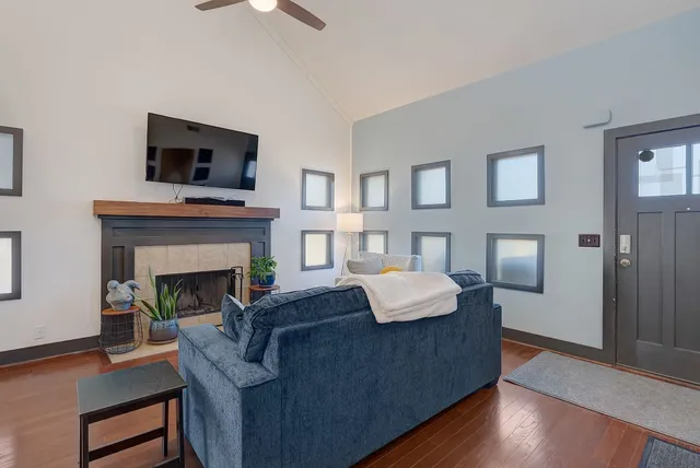 a living room with furniture and a fireplace
