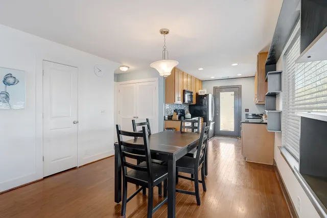 a view of a dining room with furniture window and wooden floor
