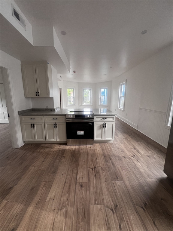 19 Reeves Street Worcester, MA 01607 - Photo 7 of 30 a view of kitchen and wooden floor