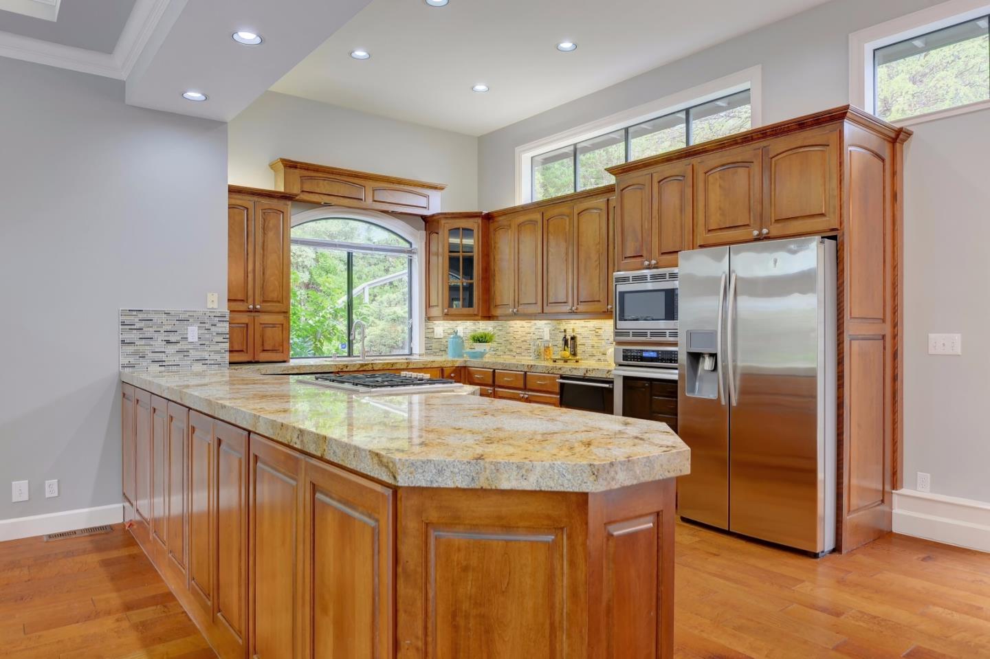 6802 Graystone Lane San Jose, CA 95120 - Photo 14 of 38 a kitchen with granite countertop a refrigerator and a sink