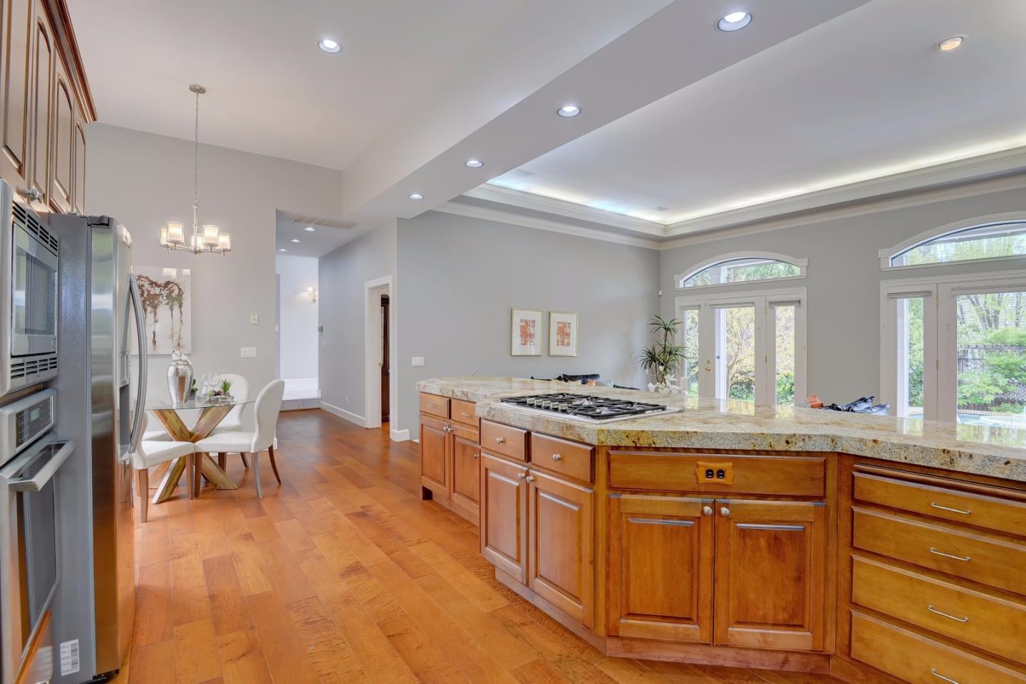 6802 Graystone Lane San Jose, CA 95120 - Photo 15 of 38 a large kitchen with stainless steel appliances granite countertop a stove and a sink