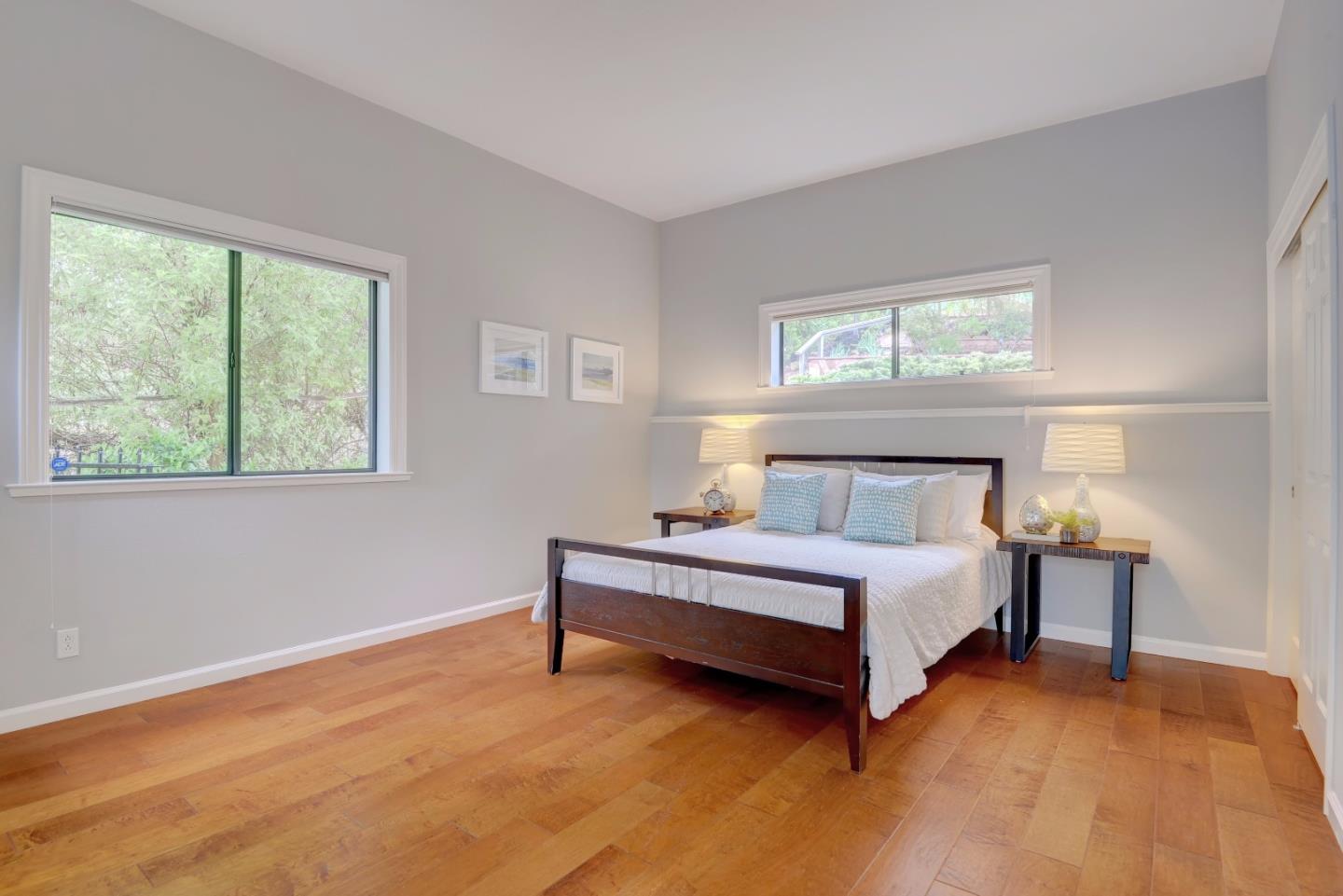 6802 Graystone Lane San Jose, CA 95120 - Photo 19 of 38 a spacious bedroom with a bed and a window