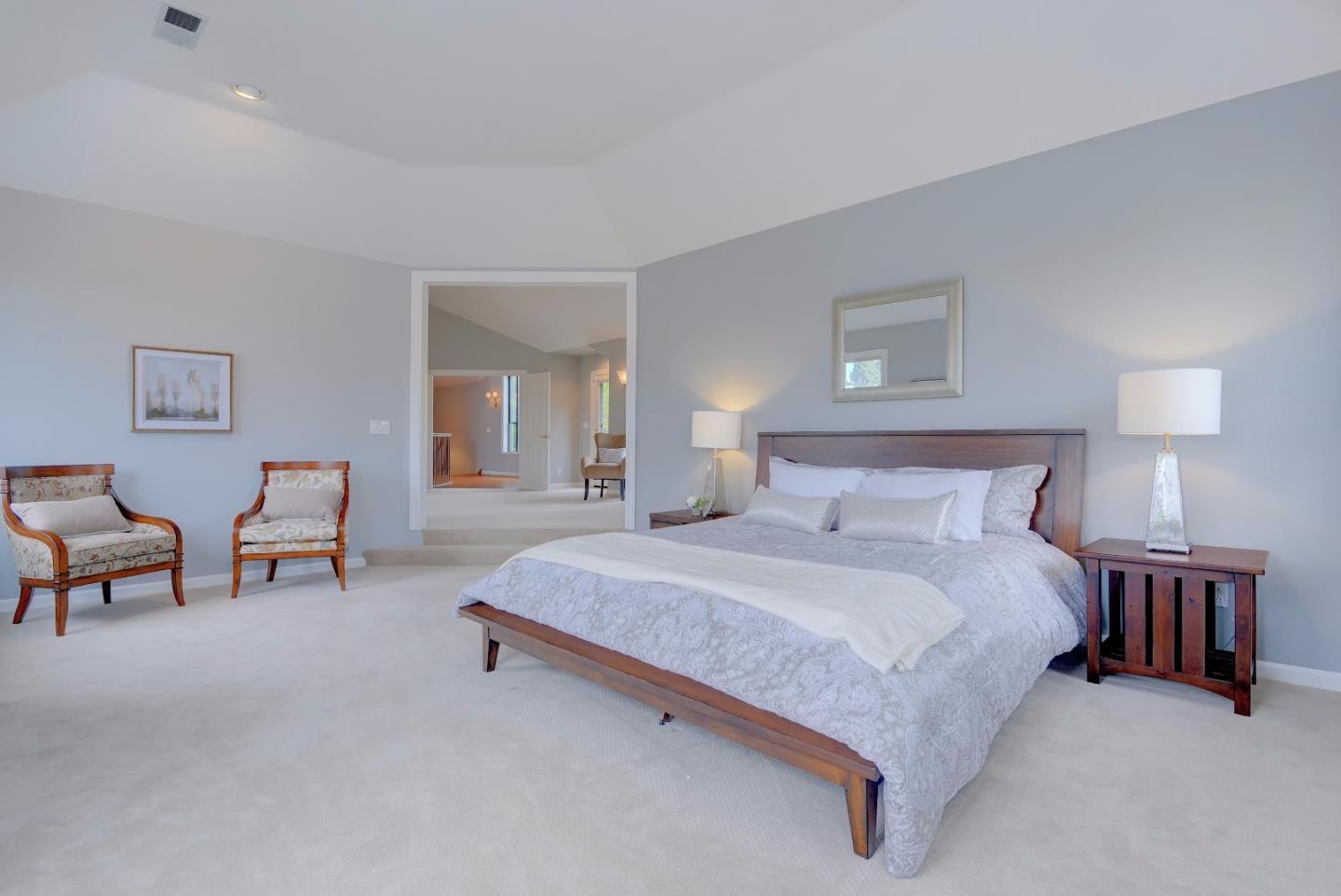 6802 Graystone Lane San Jose, CA 95120 - Photo 22 of 38 a spacious bedroom with a bed and a lamp