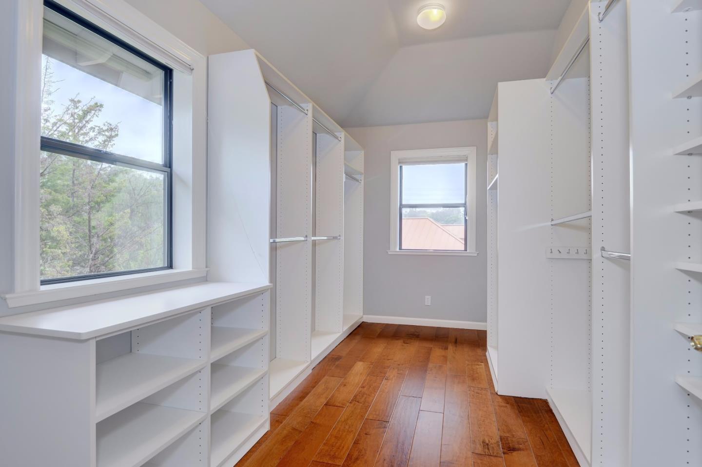 6802 Graystone Lane San Jose, CA 95120 - Photo 25 of 38 a view of hallway with a large window and wooden floor