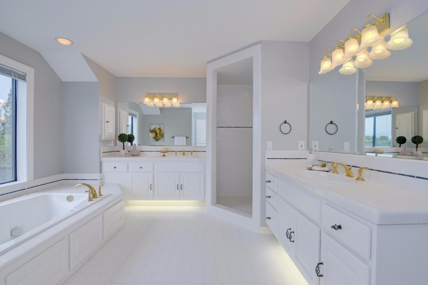 6802 Graystone Lane San Jose, CA 95120 - Photo 26 of 38 a spacious bathroom with a tub sink and mirror