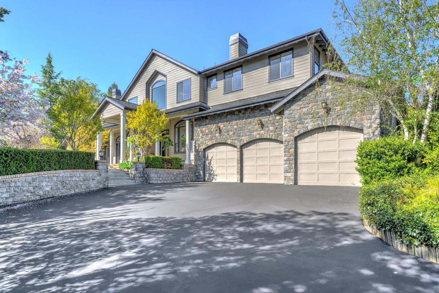 6802 Graystone Lane San Jose, CA 95120 - Photo 3 of 38 a front view of a house with a yard and garage