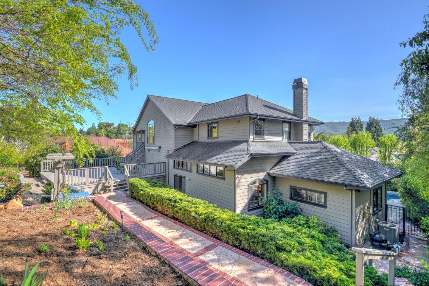 6802 Graystone Lane San Jose, CA 95120 - Photo 35 of 38 a front view of a house with a garden