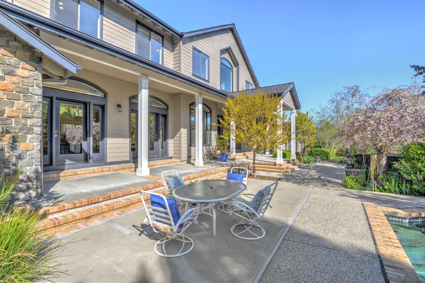 6802 Graystone Lane San Jose, CA 95120 - Photo 5 of 38 front view of a house with a table and chairs