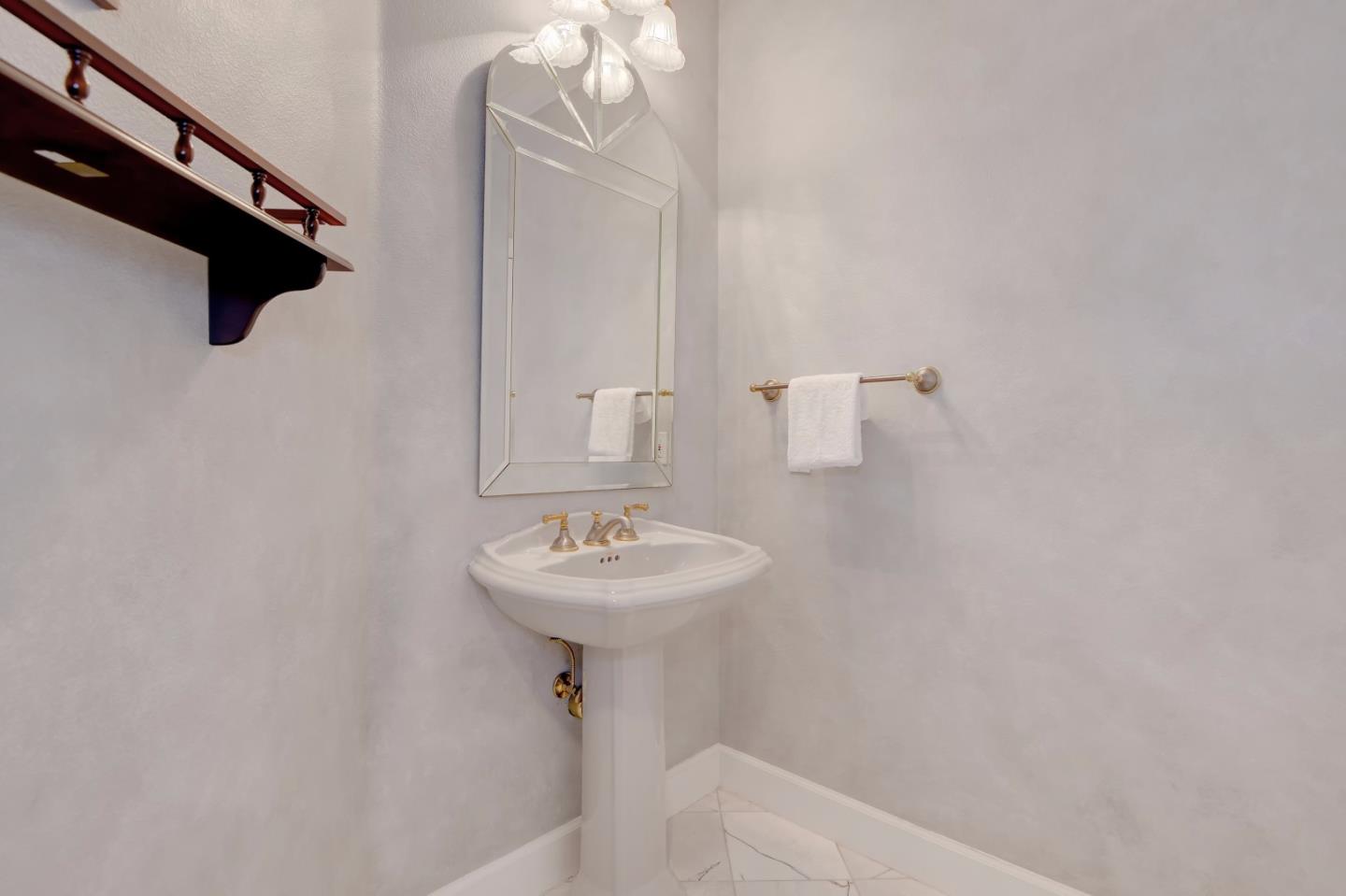 6802 Graystone Lane San Jose, CA 95120 - Photo 9 of 38 a bathroom with a sink a mirror and shower