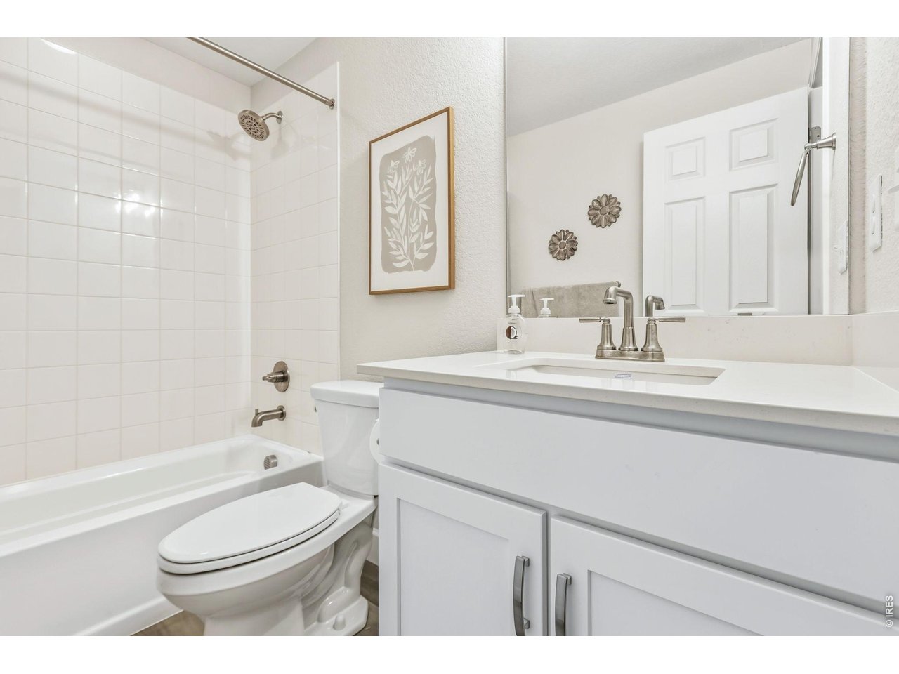 955 Rustling Street Windsor, CO 80550 - Photo 27 of 34 a bathroom with a sink a toilet and shower