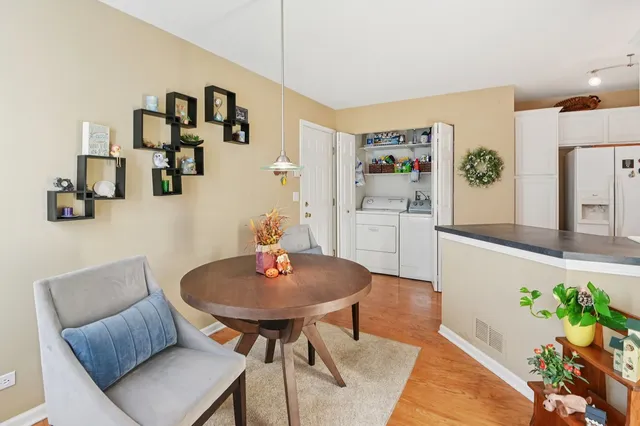 a living room with furniture and flowers