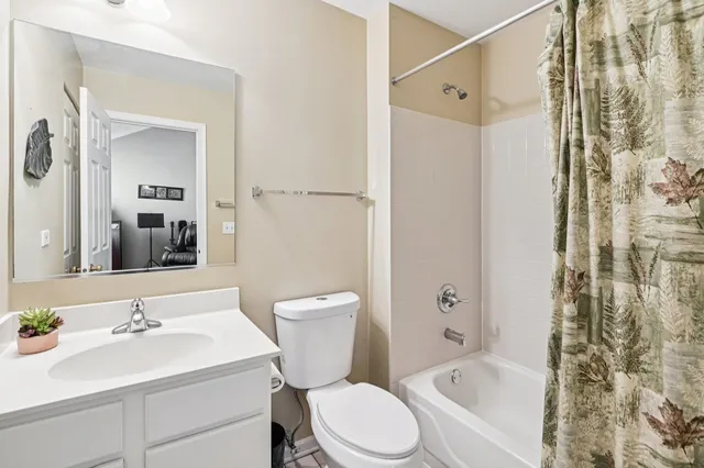 a bathroom with a sink toilet a shower and a mirror
