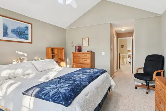 a bedroom with a bed and dresser