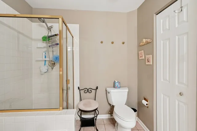 a white toilet sitting next to a bathroom sink