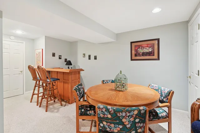 a dining room with a table and chairs