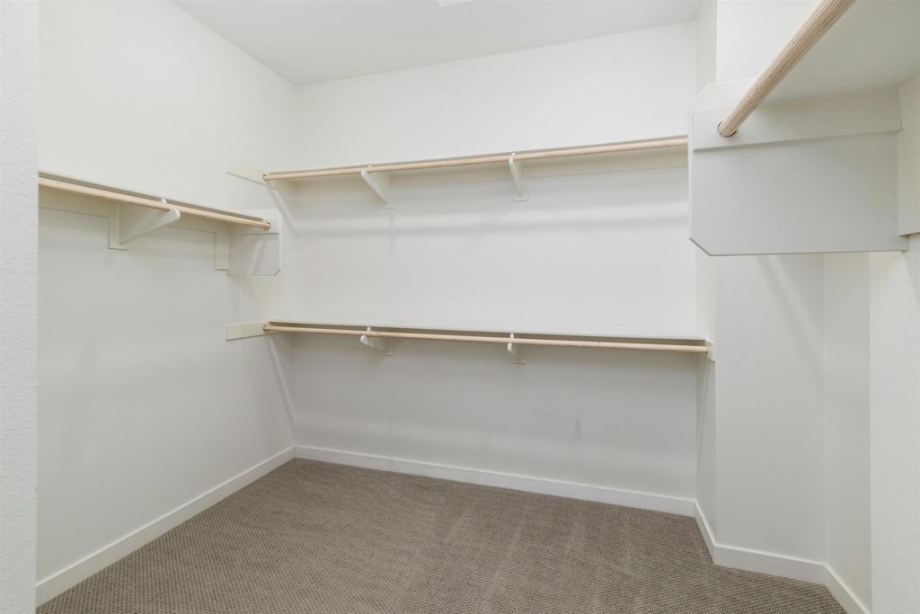 6140 Colt Place, Unit 104 Carlsbad, CA 92009 - Photo 19 of 37 a view of an empty walk in closet