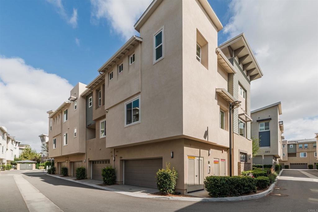 6140 Colt Place, Unit 104 Carlsbad, CA 92009 - Photo 30 of 37 a front view of a building with street