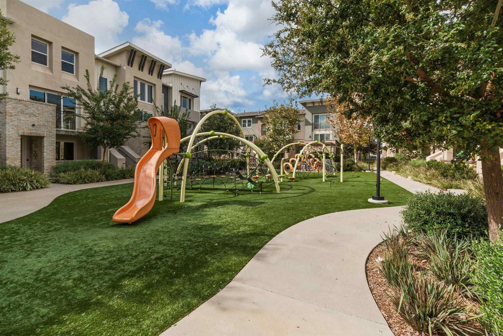 6140 Colt Place, Unit 104 Carlsbad, CA 92009 - Photo 34 of 37 a view of a garden with a slide
