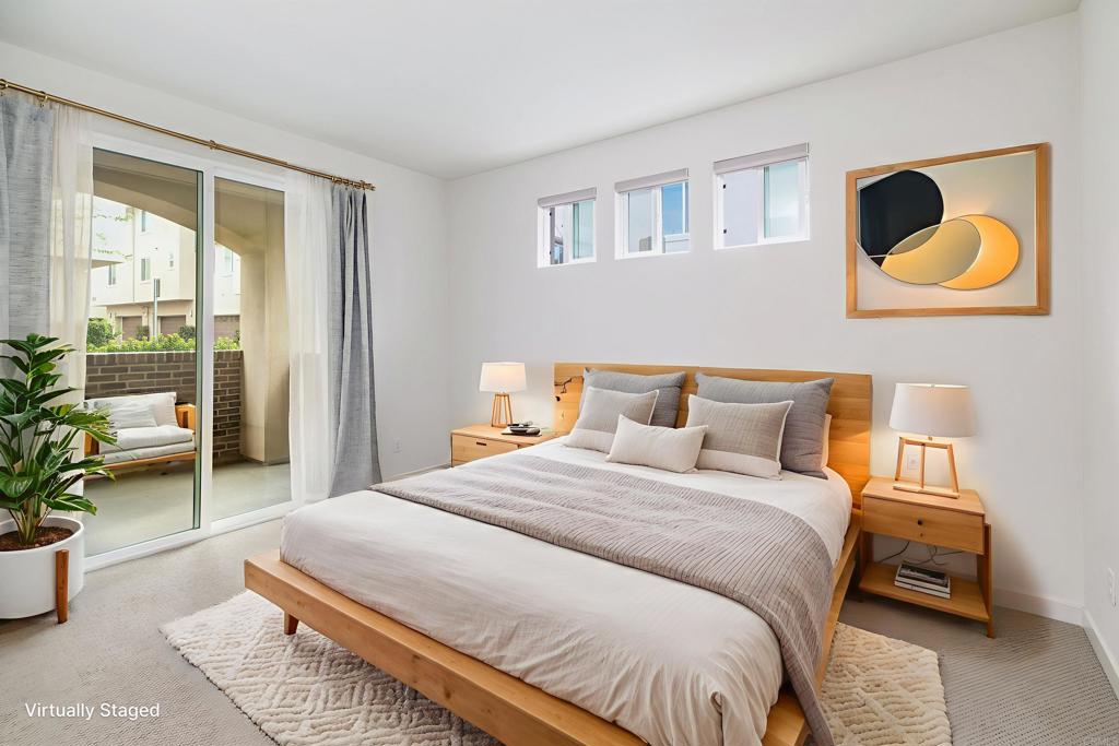 6140 Colt Place, Unit 104 Carlsbad, CA 92009 - Photo 4 of 37 a bedroom with bed and a window