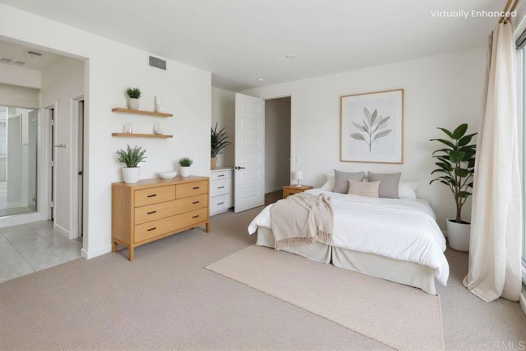 6140 Colt Place, Unit 104 Carlsbad, CA 92009 - Photo 5 of 37 a bedroom with a bed and a painting on the wall
