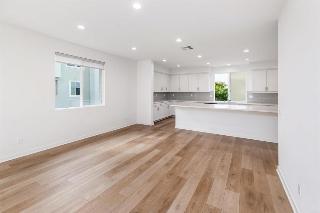 6140 Colt Place, Unit 104 Carlsbad, CA 92009 - Photo 7 of 37 a view of a kitchen with a sink and a stove top oven