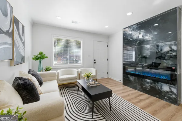 a living room with furniture and a large window