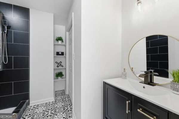 a bathroom with a sink and a mirror