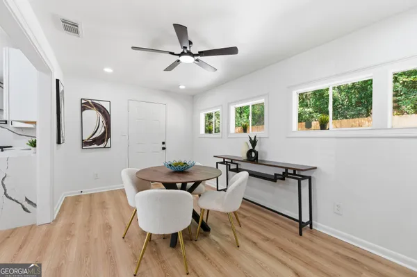 a living room with furniture and a window