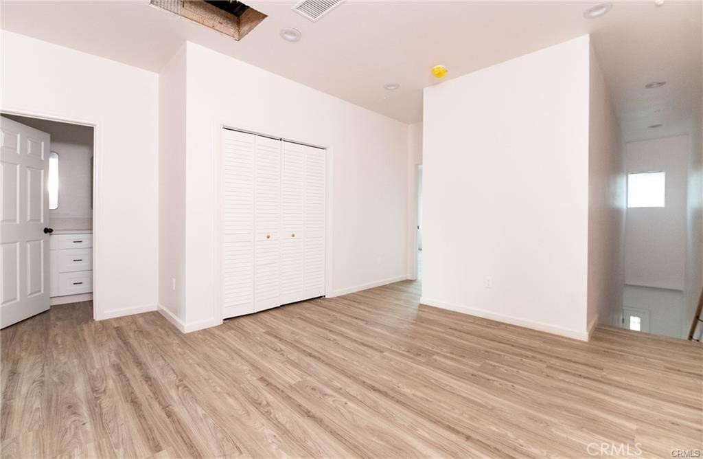 5502 East Los Angeles Avenue, Unit 3 Simi Valley, CA 93063 - Photo 11 of 48 an empty room with wooden floor