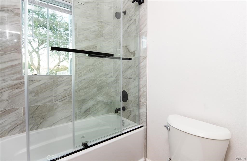 5502 East Los Angeles Avenue, Unit 3 Simi Valley, CA 93063 - Photo 17 of 48 a bathroom with a shower and toilet