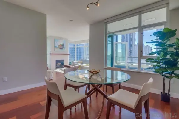 a view of a dining room with furniture window and wooden floor