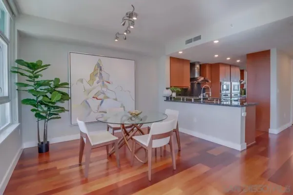 a kitchen with lots of counter top space and dining table