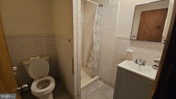 a bathroom with a toilet and a sink