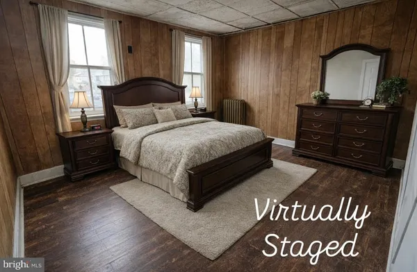 a bedroom with a bed and a dresser