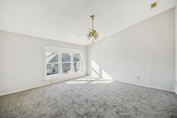 an empty room with a windows