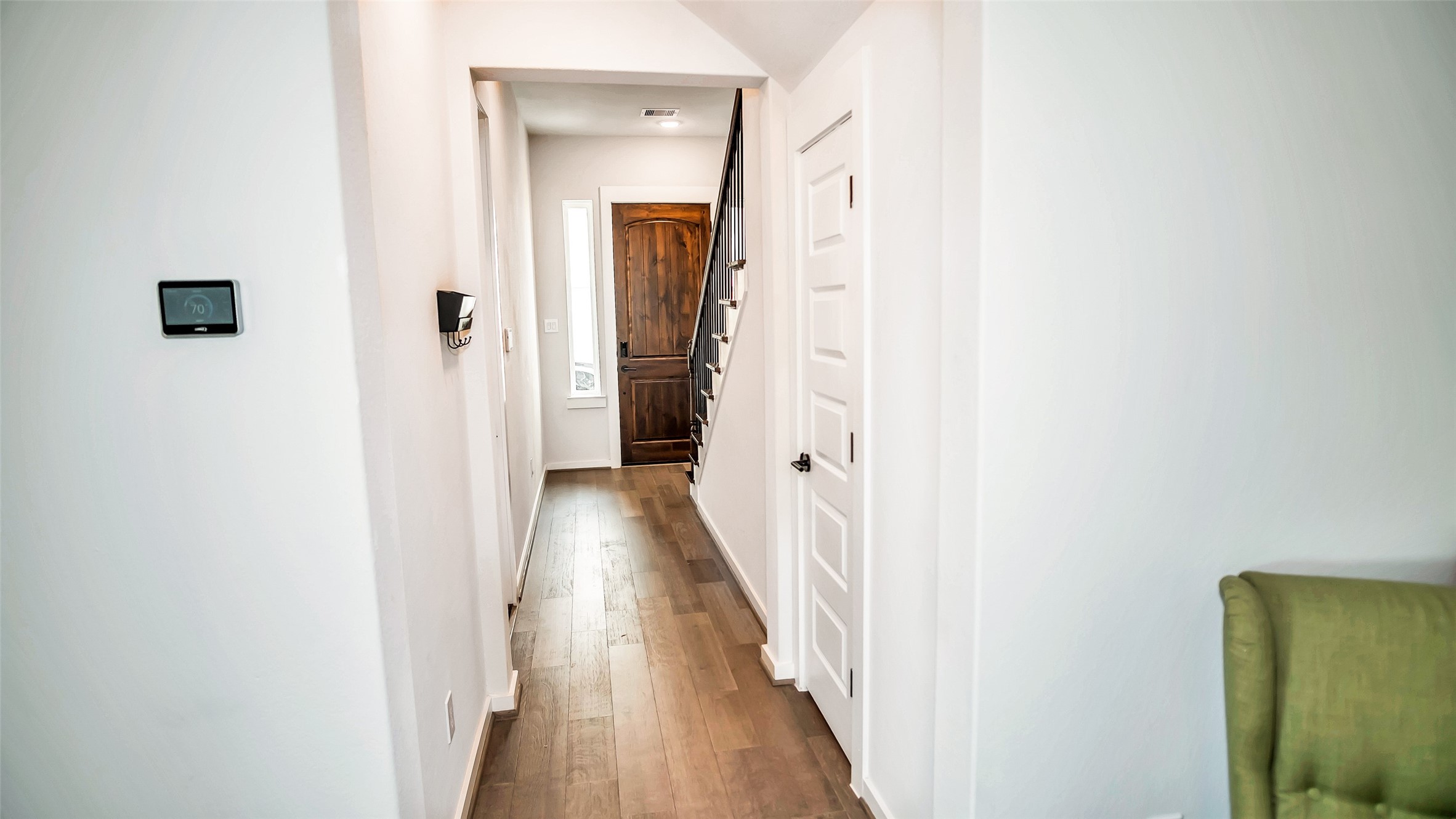 1919 Pueblo Nuevo Path Houston, TX 77077 - Photo 38 of 50 a view of a hallway with wooden floor and staircase