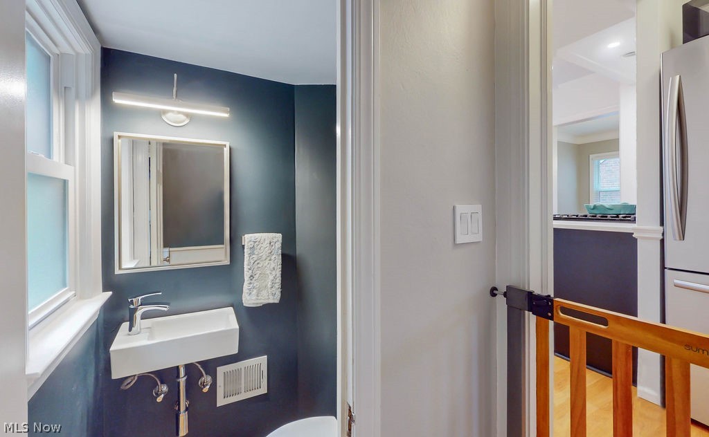 2395 Saybrook Road Cleveland, OH 44118 - Photo 10 of 31 Bathroom featuring wood-type flooring and sink