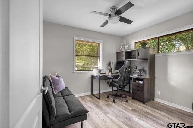a work room with furniture and a window