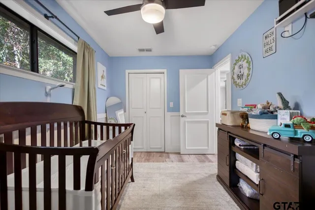 a view of hall way with furniture and a window