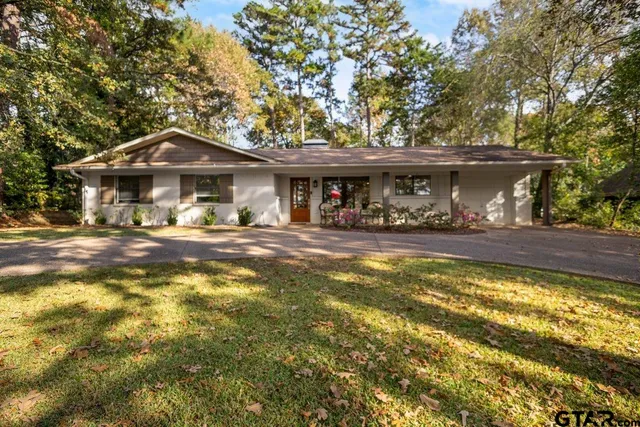 a front view of a house with swimming pool