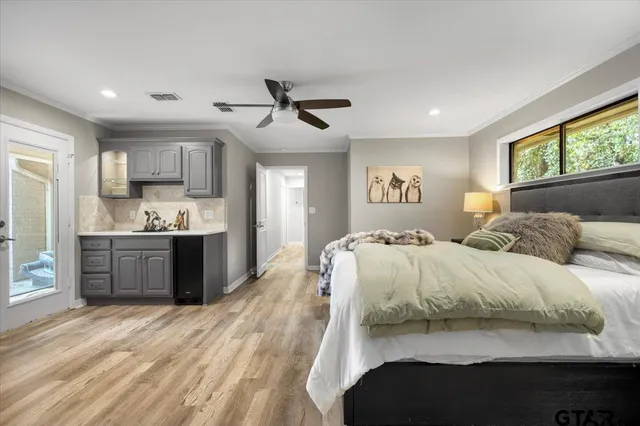 a bedroom with a large bed and a window