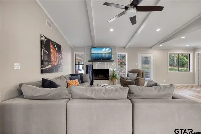 a living room with furniture and a fireplace