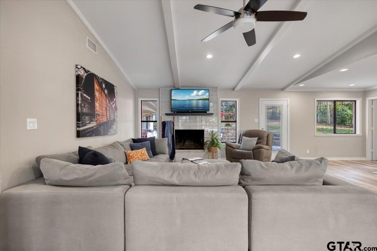 441 Hideaway Lane Hideaway, TX 75771 - Photo 7 of 38 a living room with furniture and a fireplace