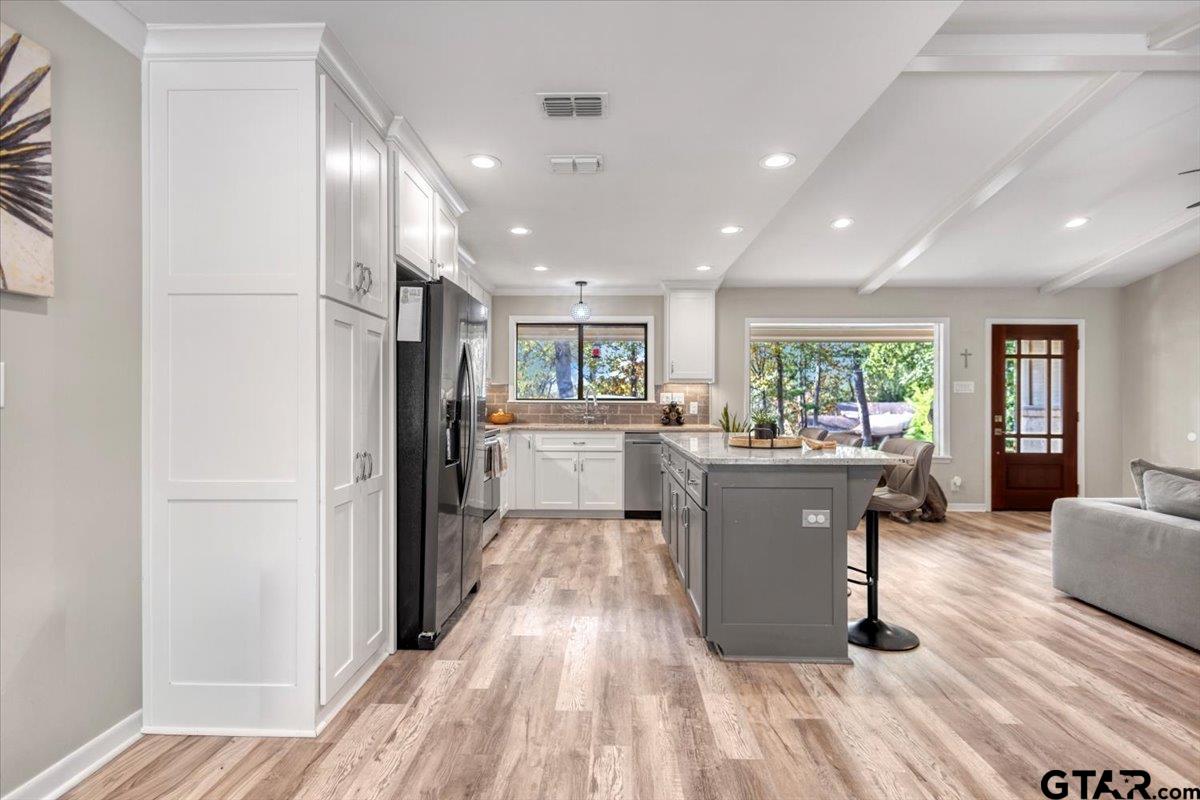 441 Hideaway Lane Hideaway, TX 75771 - Photo 9 of 38 a living room with stainless steel appliances kitchen island granite countertop furniture and a refrigerator