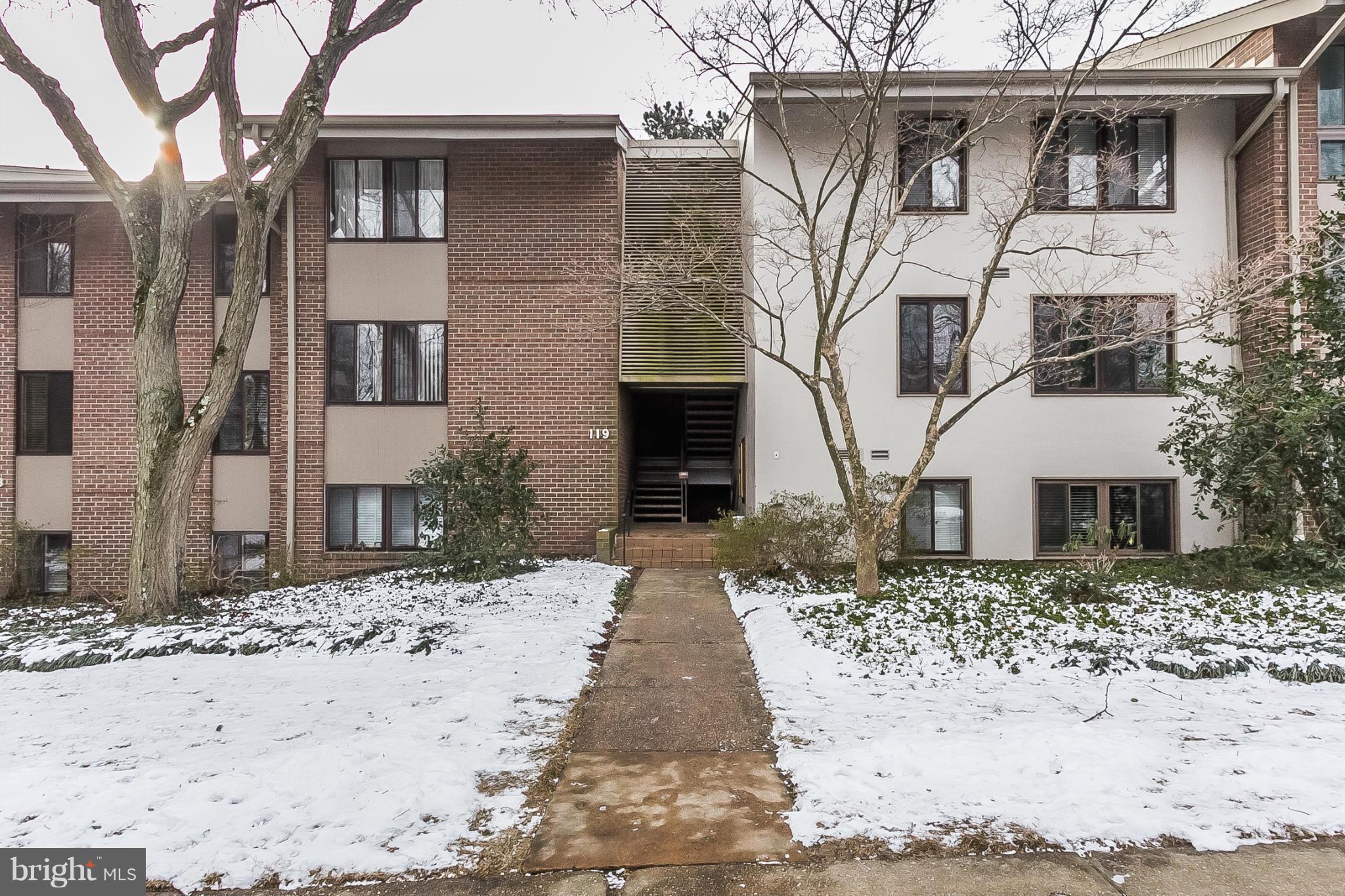119 Cross Keys Road, Unit R119E Baltimore, MD 21210 - Photo 1 of 22 a view of a grey house with a yard