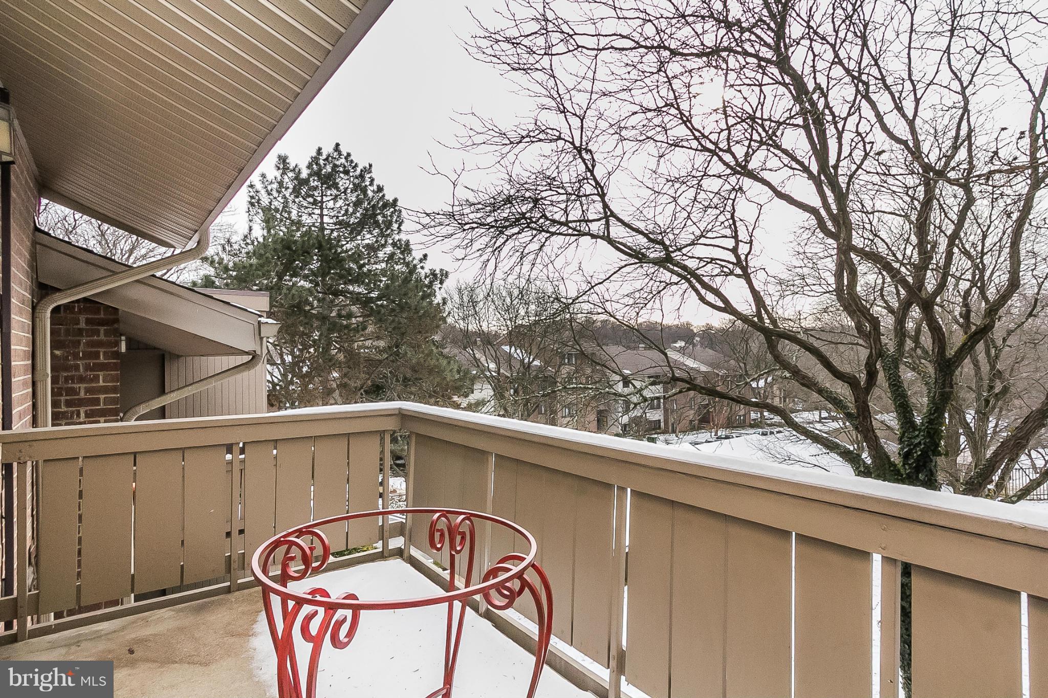 119 Cross Keys Road, Unit R119E Baltimore, MD 21210 - Photo 20 of 22 a view of a street with a tree