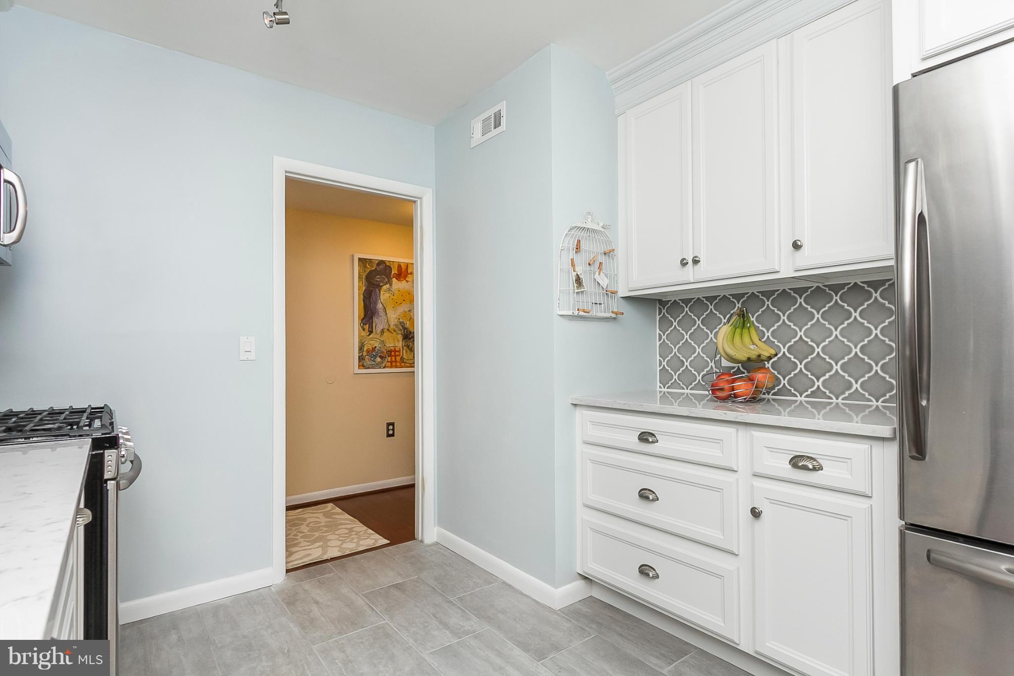 119 Cross Keys Road, Unit R119E Baltimore, MD 21210 - Photo 3 of 22 a view of an entryway with wooden floor