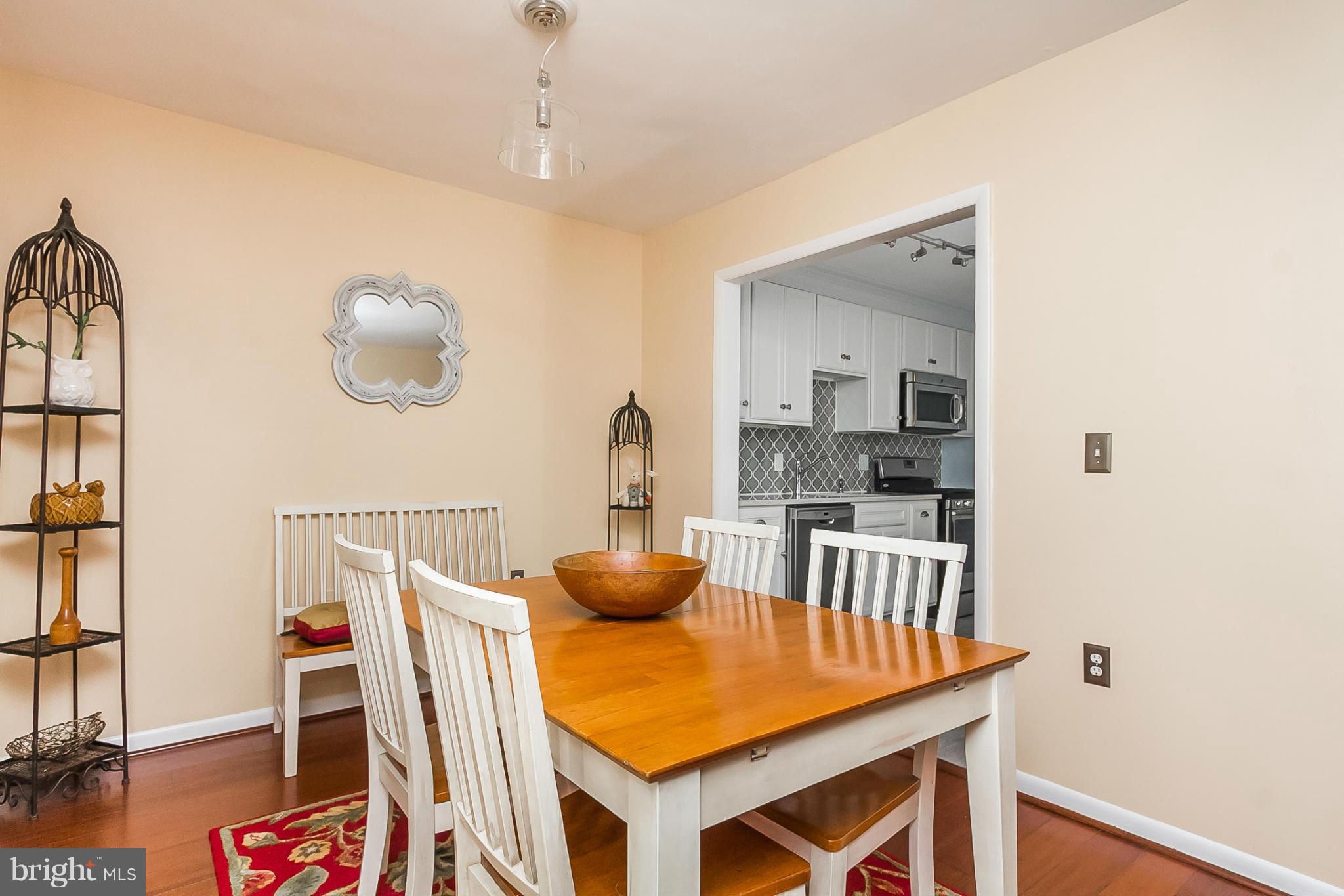 119 Cross Keys Road, Unit R119E Baltimore, MD 21210 - Photo 9 of 22 a dining room with furniture and wooden floor