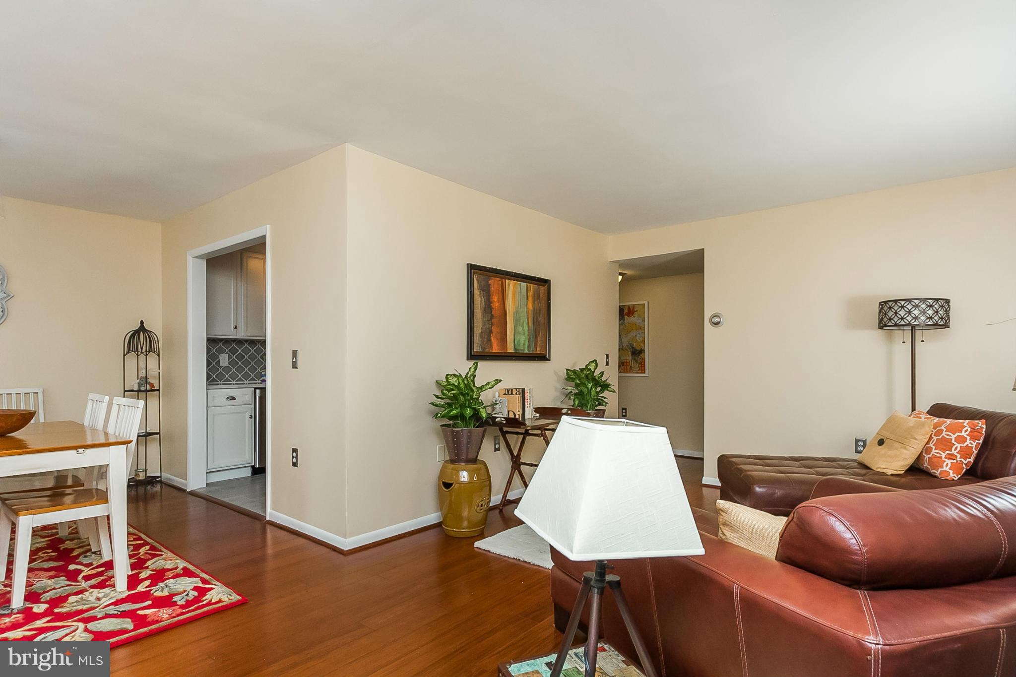 119 Cross Keys Road, Unit R119E Baltimore, MD 21210 - Photo 10 of 22 a living room with furniture and wooden floor